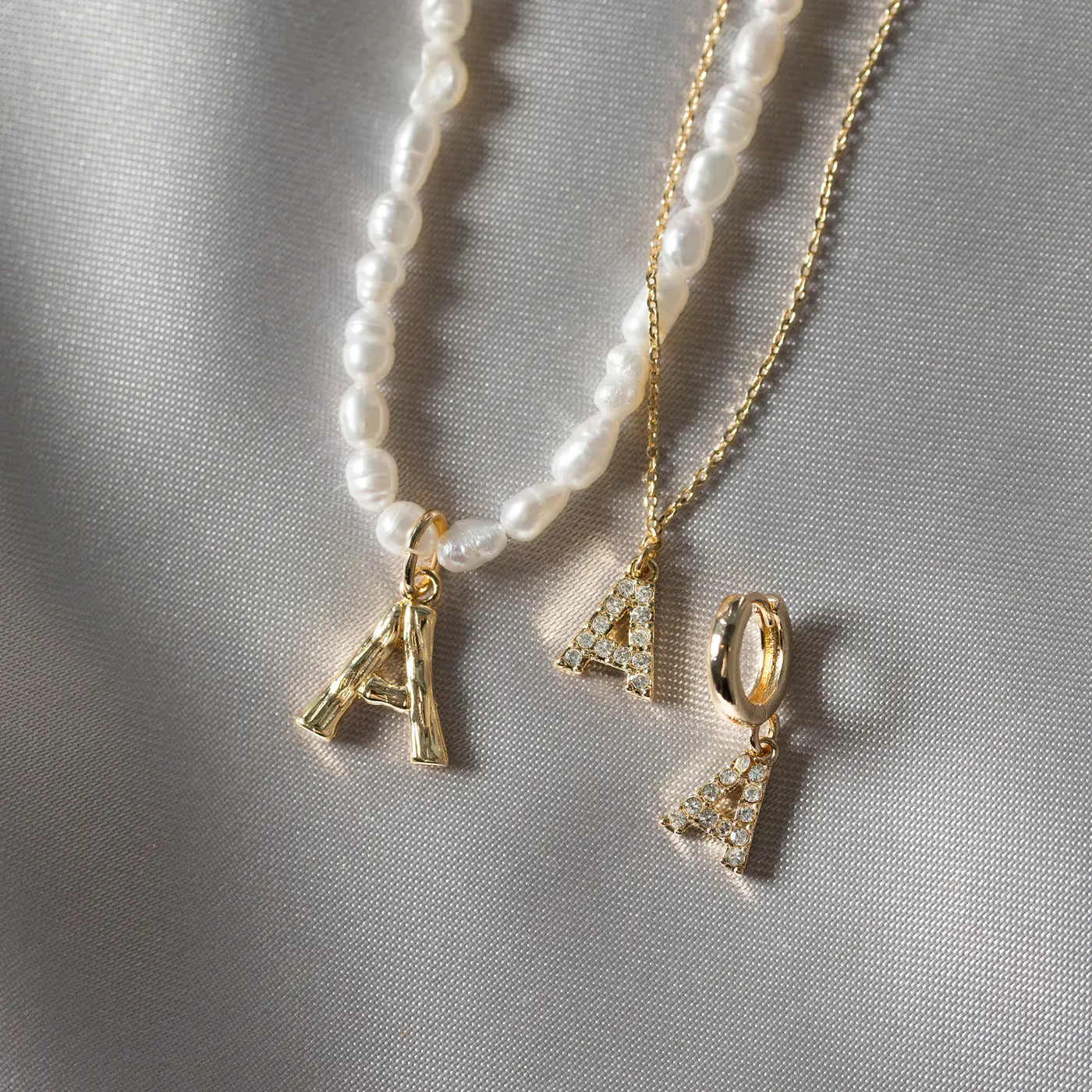 Parel en bamboe brief ketting