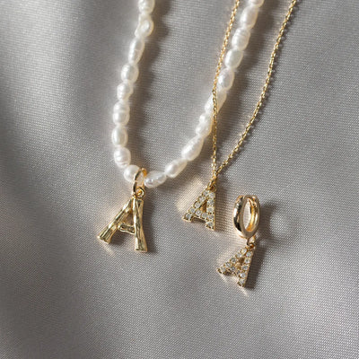 Parel en bamboe brief ketting