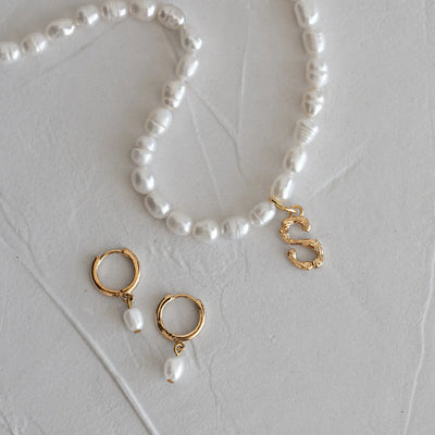Parel en bamboe brief ketting
